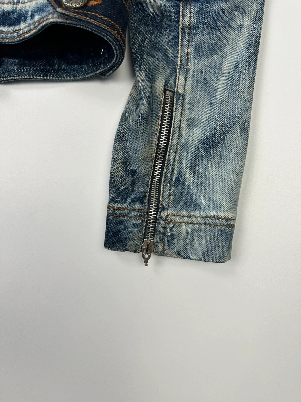Just Cavalli sky blue denim jacket with multiple zippers and unique print design.
