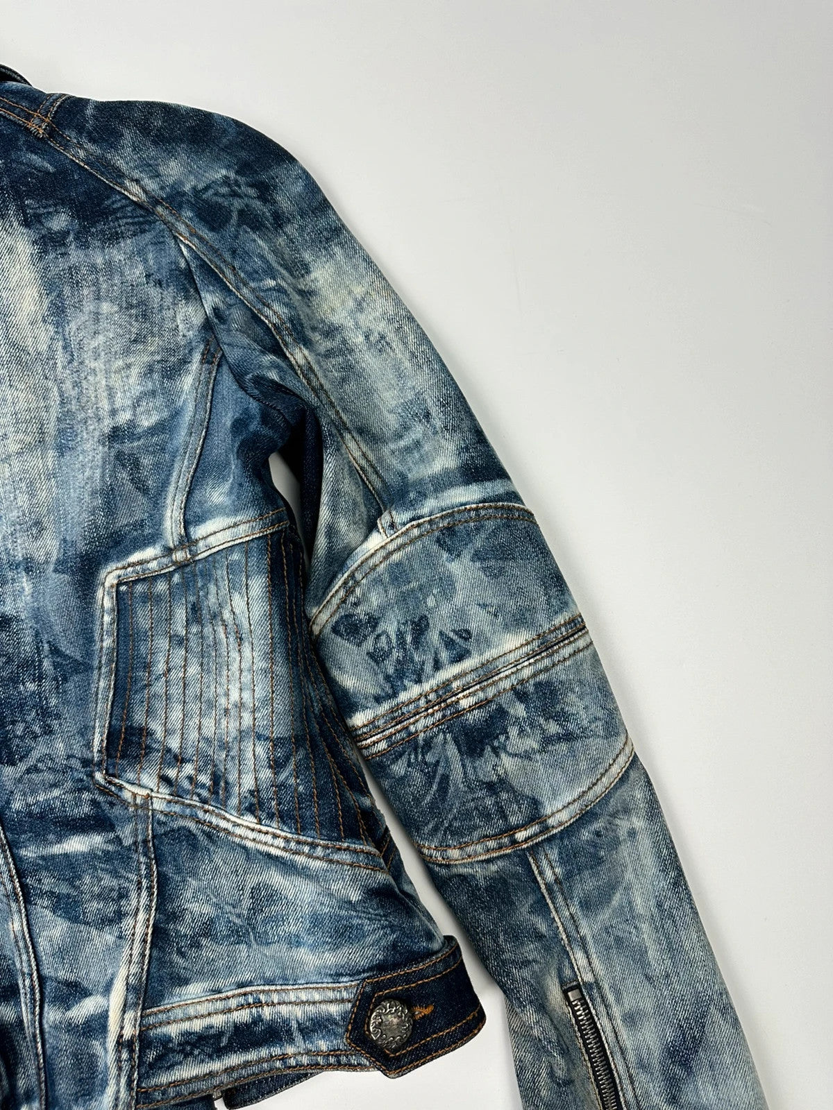 Just Cavalli sky blue denim jacket with multiple zippers and unique print design.