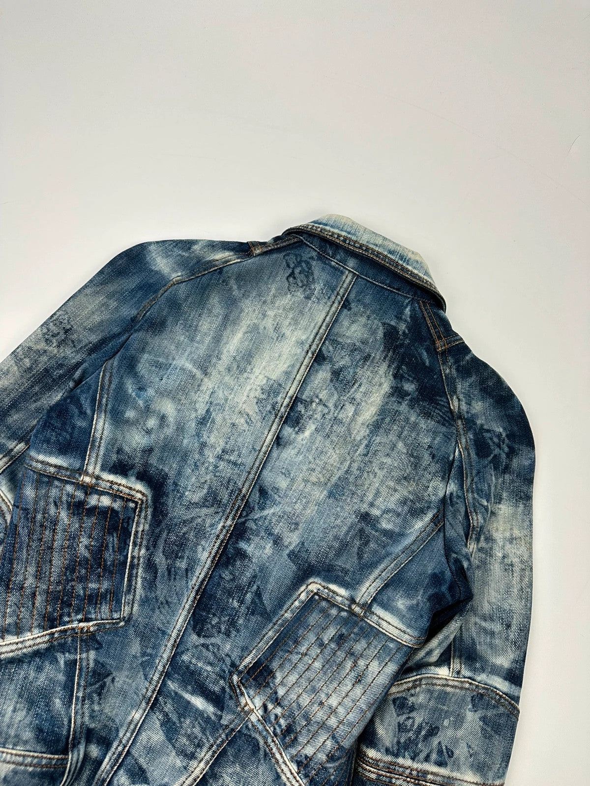 Just Cavalli sky blue denim jacket with multiple zippers and unique print design.