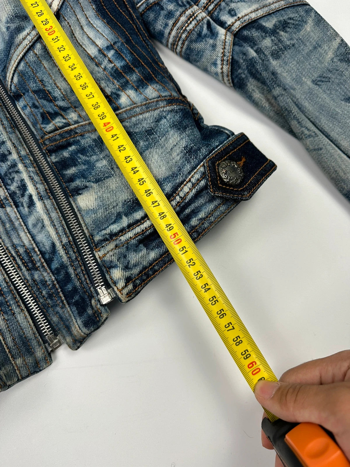 Just Cavalli sky blue denim jacket with multiple zippers and unique print design.