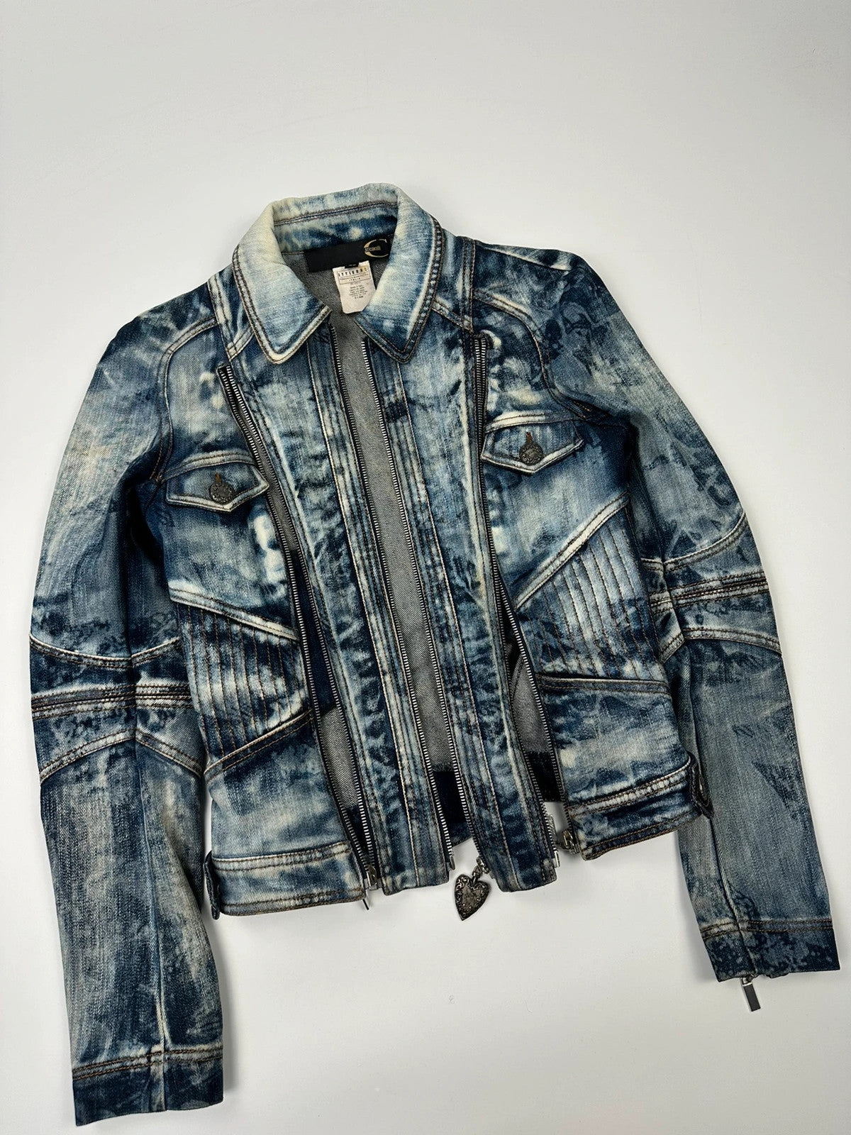 Just Cavalli sky blue denim jacket with multiple zippers and unique print design.
