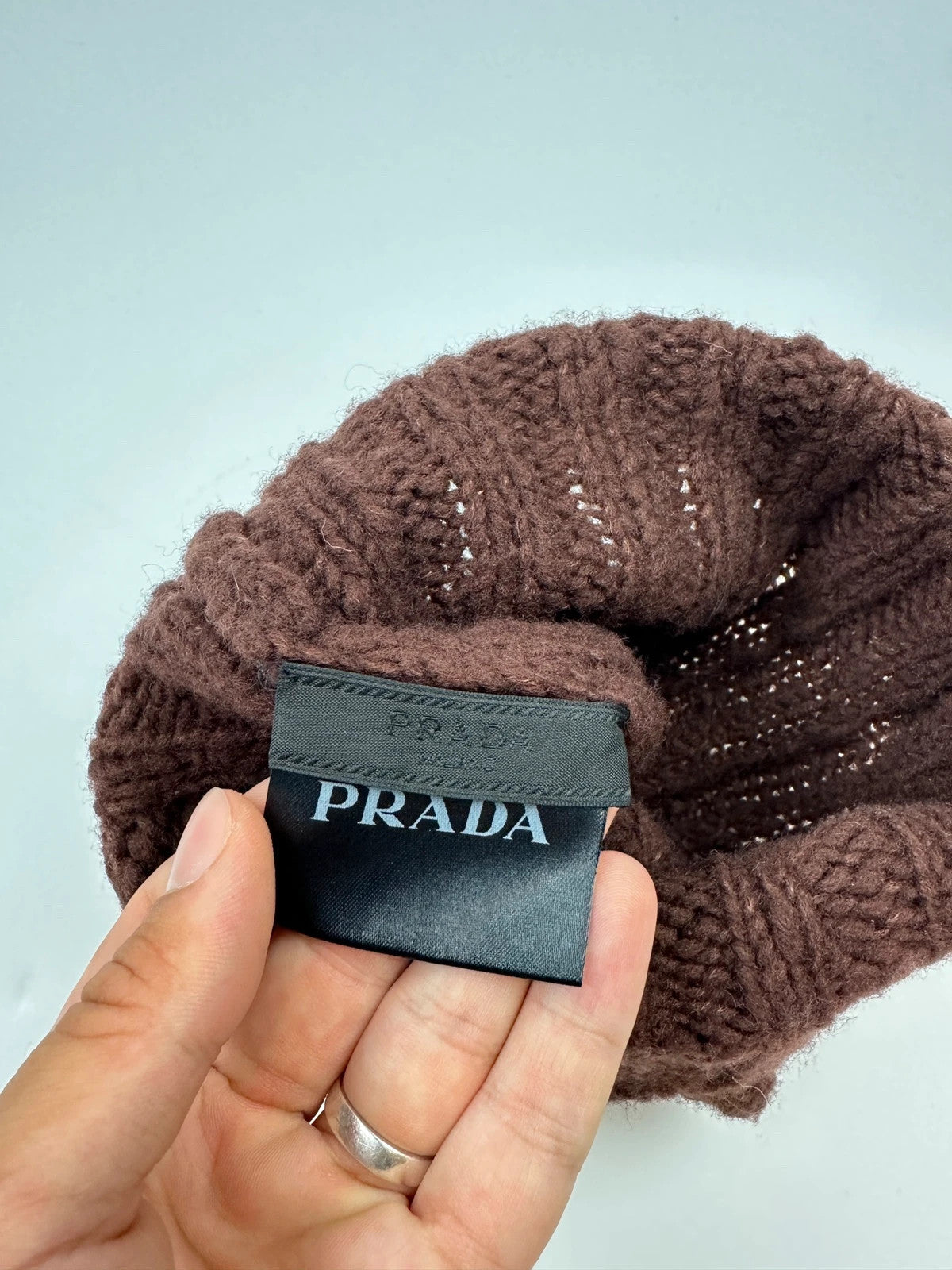 Prada brown wool knitted beanie with red logo tab from FW2014 collection.