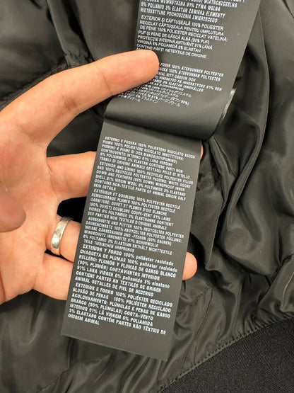 Prada khaki puffer down jacket with hood, featuring triangle logo and luxurious material.