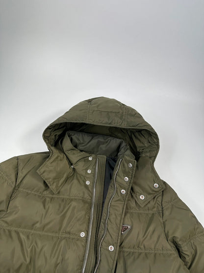 Prada khaki puffer down jacket with hood, featuring triangle logo and luxurious material.