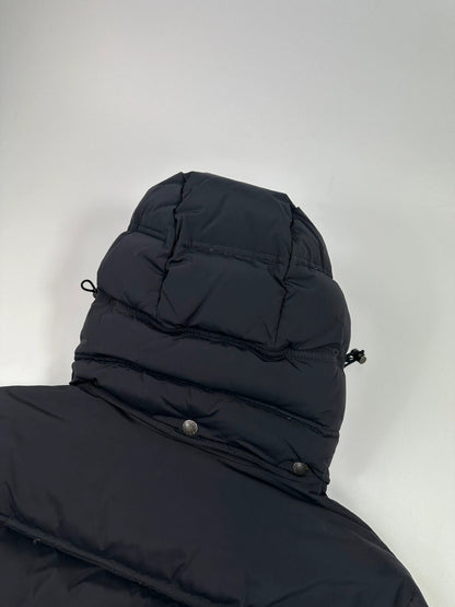 Prada dark navy hooded puffer jacket with triangle logo and vintage 2000s design.