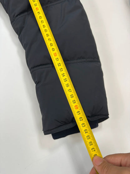 Prada dark navy hooded puffer jacket with triangle logo and vintage 2000s design.