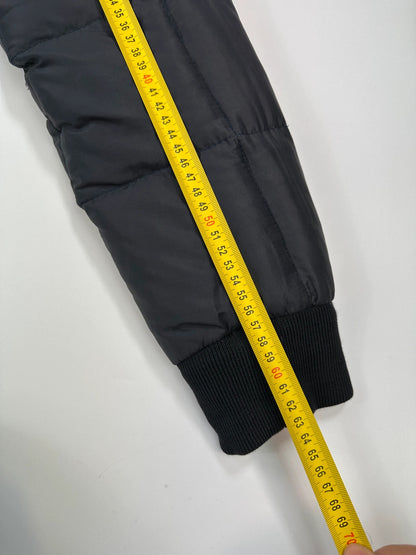 Moncler navy blue puffer jacket with French logo and hood, down-filled material.