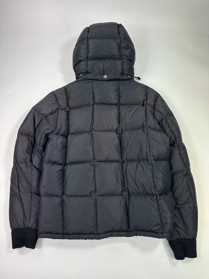 Moncler navy blue puffer jacket with French logo and hood, down-filled material.