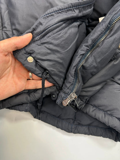 Moncler navy blue puffer jacket with French logo and hood, down-filled material.