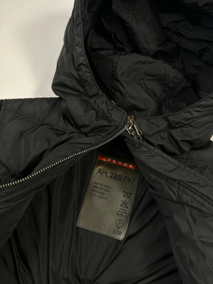 Prada black fitted nylon down puffer jacket with hood and logo detail.