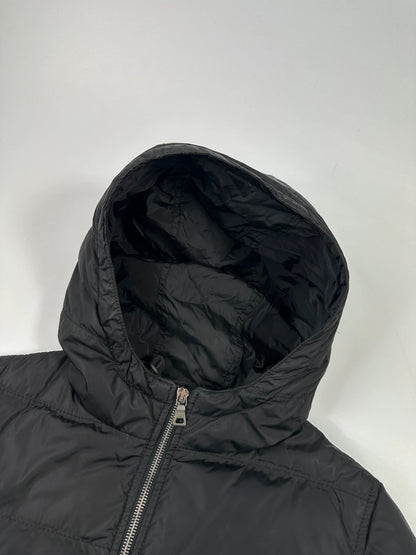 Prada black fitted nylon down puffer jacket with hood and logo detail.