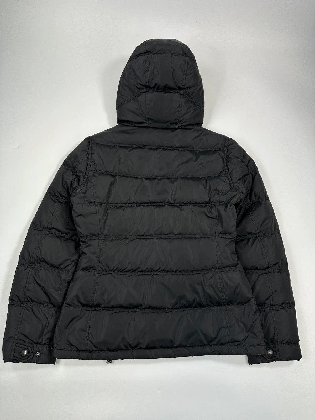 Prada black fitted nylon down puffer jacket with hood and logo detail.