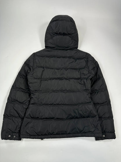 Prada black fitted nylon down puffer jacket with hood and logo detail.