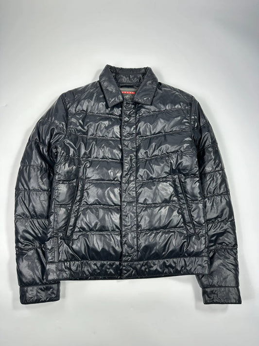 Prada black puffer jacket with shirt collar and Ripstop nylon fabric.