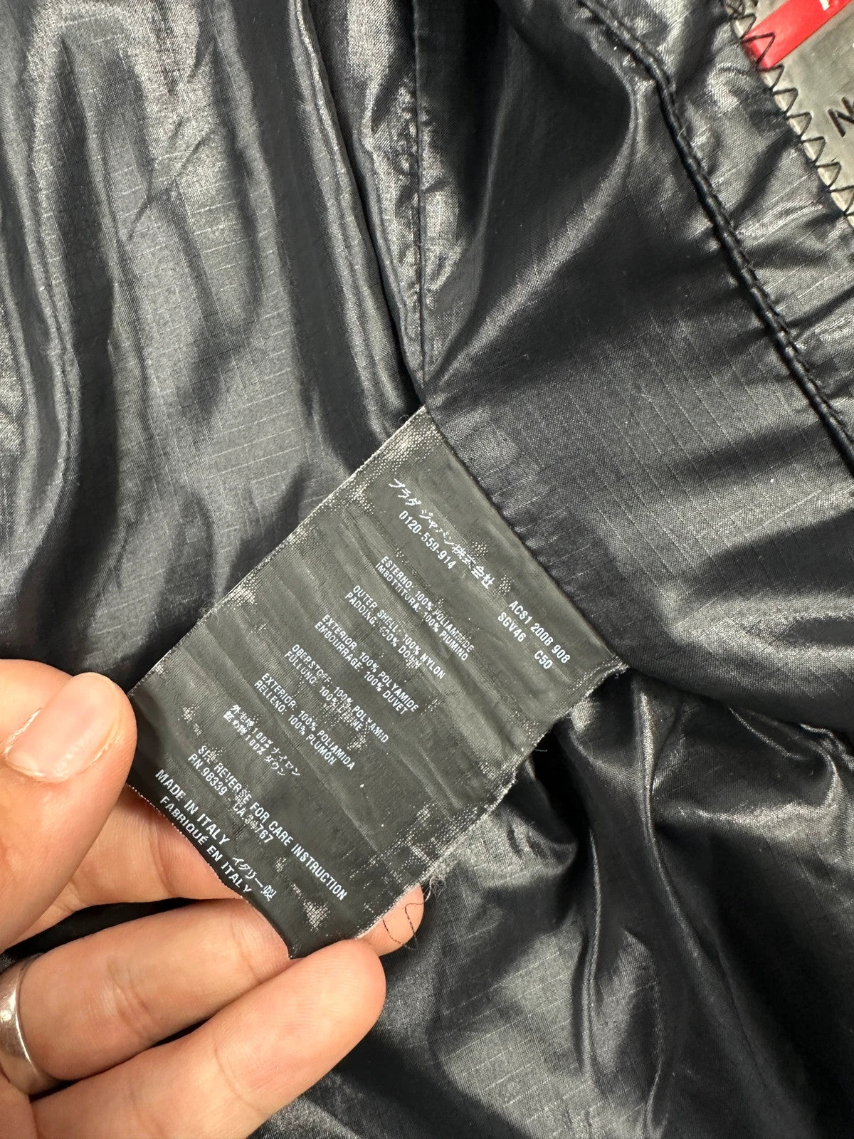 Prada black puffer jacket with shirt collar and Ripstop nylon fabric.