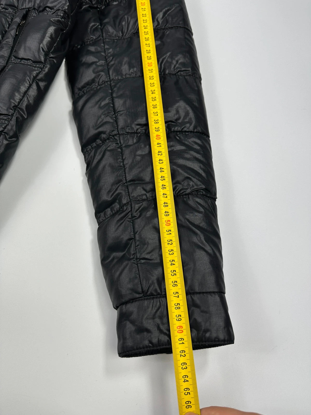 Prada black puffer jacket with shirt collar and Ripstop nylon fabric.