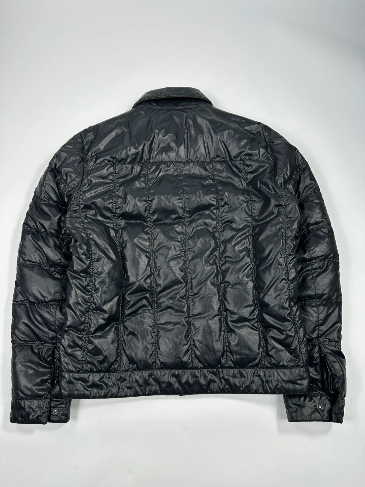 Prada black puffer jacket with shirt collar and Ripstop nylon fabric.