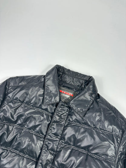 Prada black puffer jacket with shirt collar and Ripstop nylon fabric.