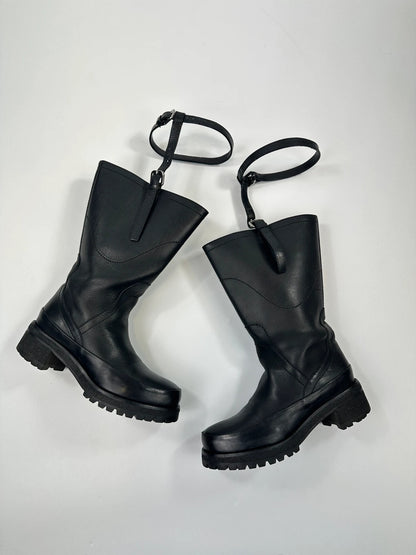 Prada black leather garter strap boots with minimalist design and original box.