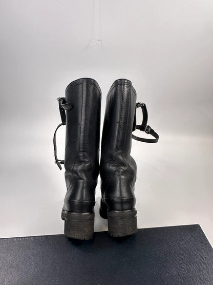 Prada black leather garter strap boots with minimalist design and original box.