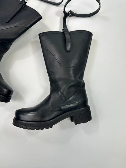 Prada black leather garter strap boots with minimalist design and original box.