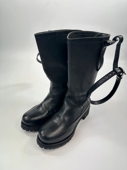 Prada black leather garter strap boots with minimalist design and original box.