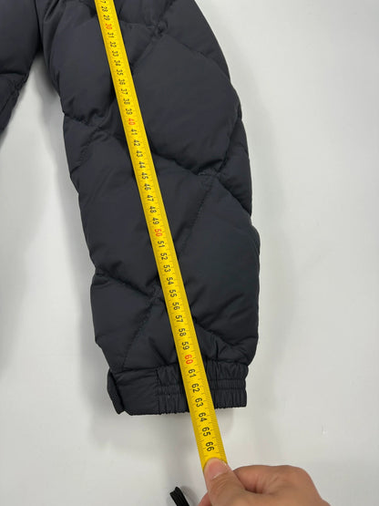 Moncler navy blue puffer jacket with diamond pattern, hood, and down filling.