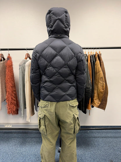 Moncler navy blue puffer jacket with diamond pattern, hood, and down filling.