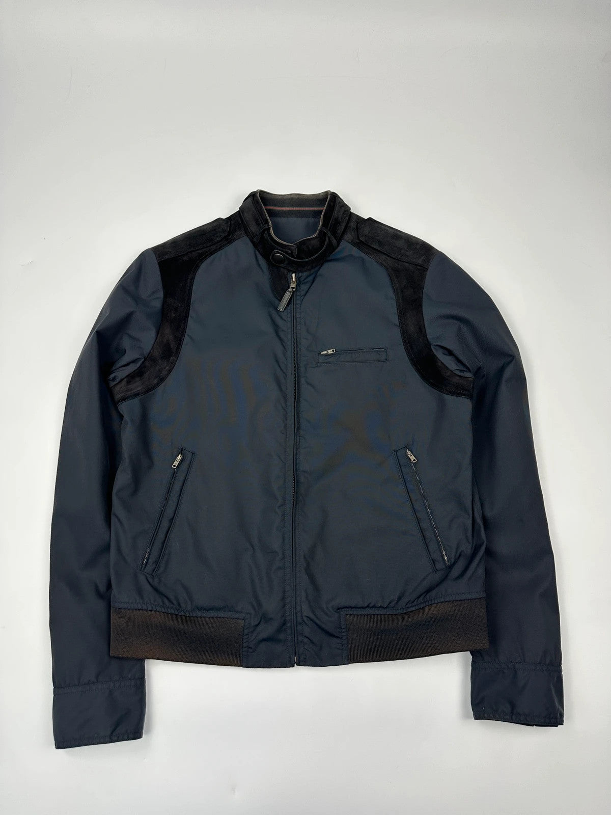 Gucci navy blue bomber jacket with suede inserts and vintage 2000s design.