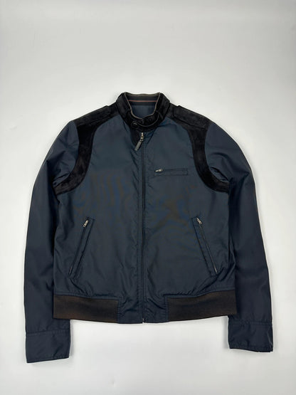 Gucci navy blue bomber jacket with suede inserts and vintage 2000s design.