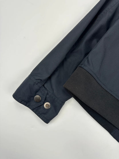 Gucci navy blue bomber jacket with suede inserts and vintage 2000s design.