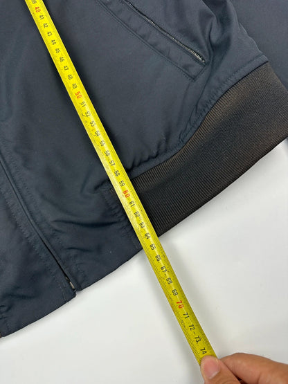 Gucci navy blue bomber jacket with suede inserts and vintage 2000s design.