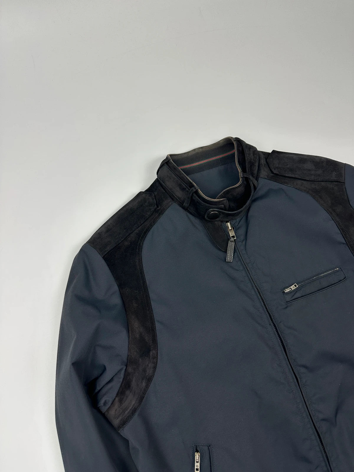 Gucci navy blue bomber jacket with suede inserts and vintage 2000s design.