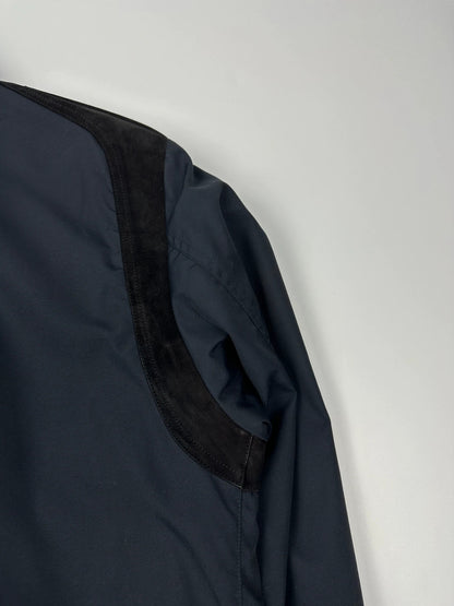 Gucci navy blue bomber jacket with suede inserts and vintage 2000s design.