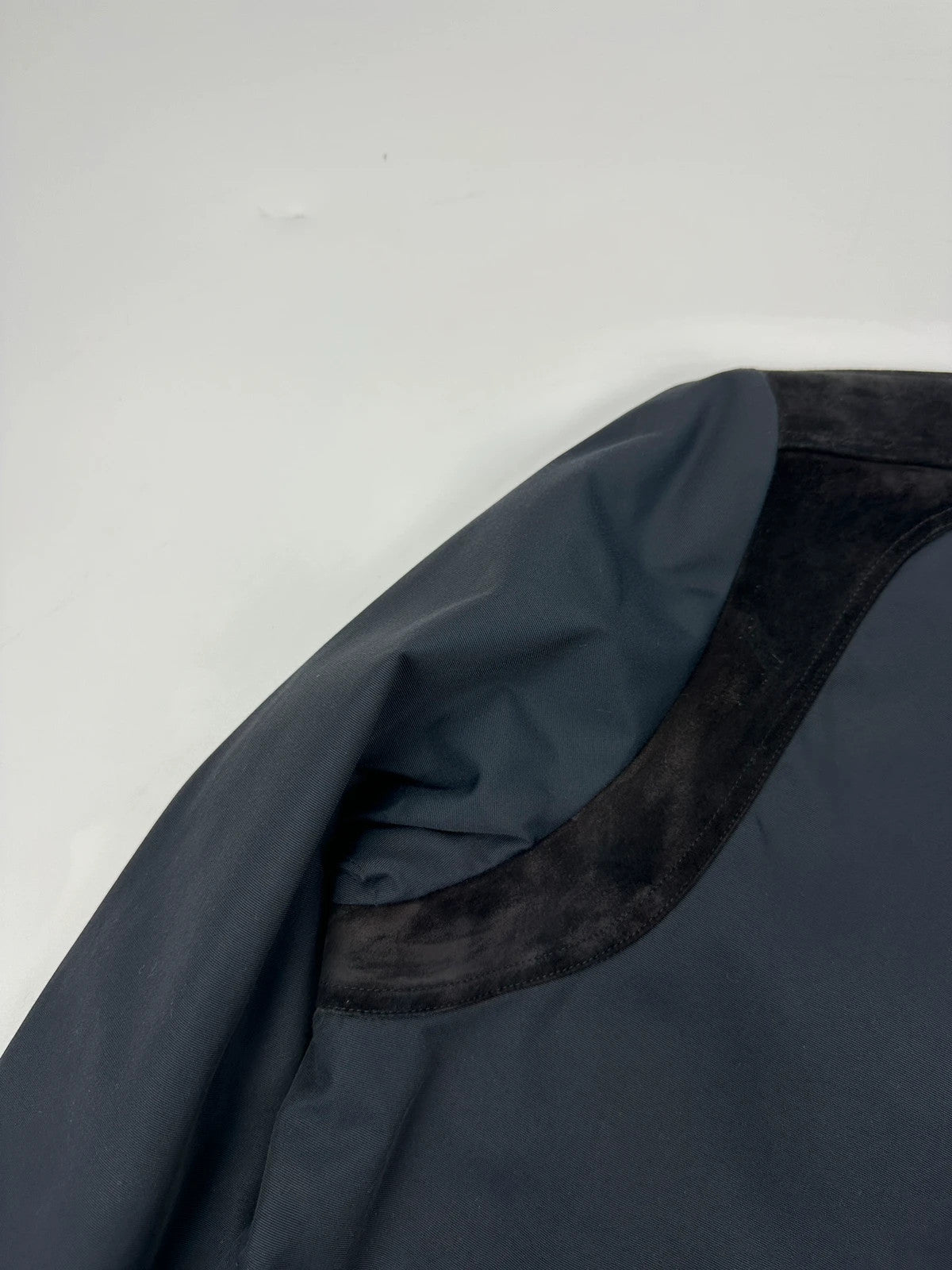 Gucci navy blue bomber jacket with suede inserts and vintage 2000s design.