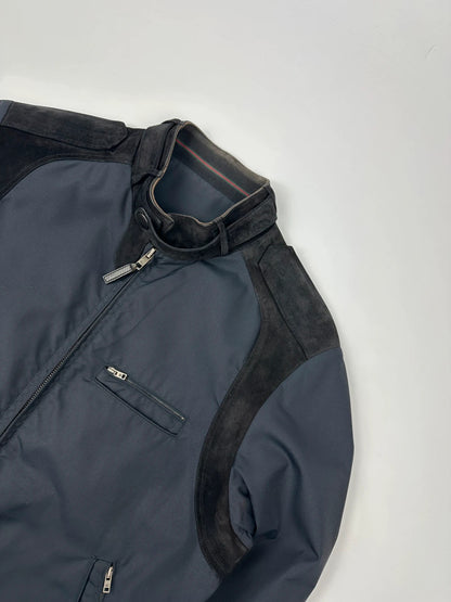 Gucci navy blue bomber jacket with suede inserts and vintage 2000s design.