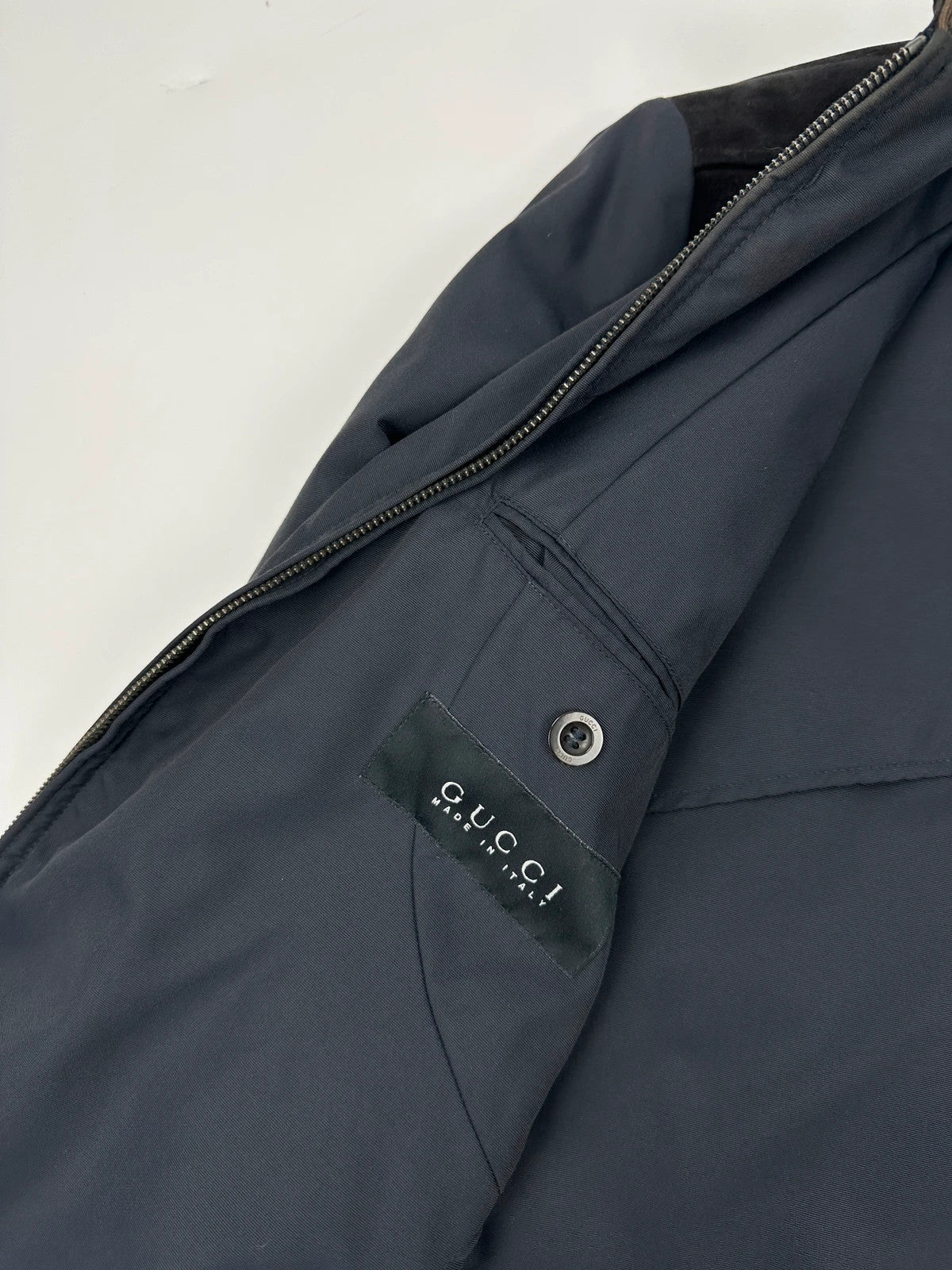 Gucci navy blue bomber jacket with suede inserts and vintage 2000s design.
