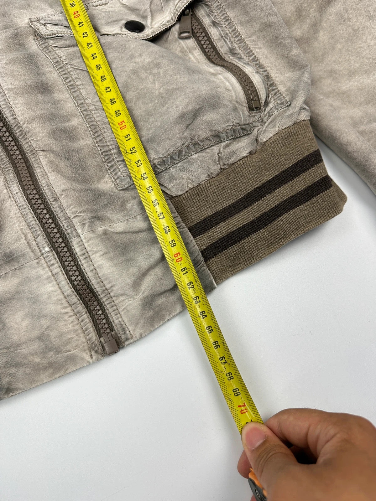 Dolce & Gabbana beige grey bomber jacket with faded nylon and logo details.