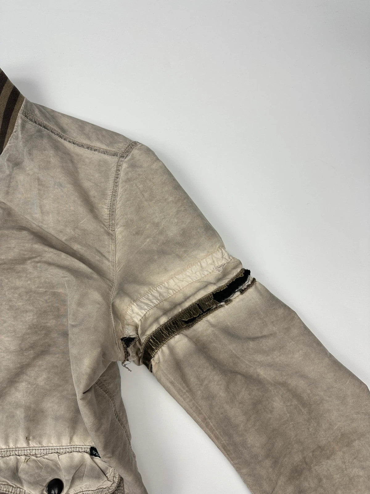Dolce & Gabbana beige grey bomber jacket with faded nylon and logo details.