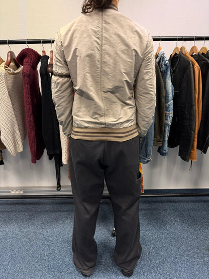 Dolce & Gabbana beige grey bomber jacket with faded nylon and logo details.