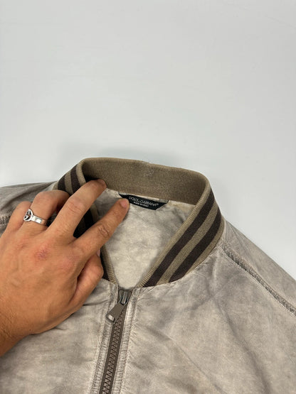 Dolce & Gabbana beige grey bomber jacket with faded nylon and logo details.