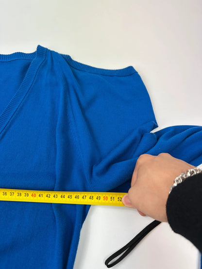Maison Margiela electric blue cardigan with shoulder holes, minimalist design, soft knit material.