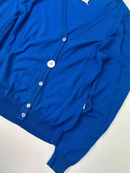 Maison Margiela electric blue cardigan with shoulder holes, minimalist design, soft knit material.