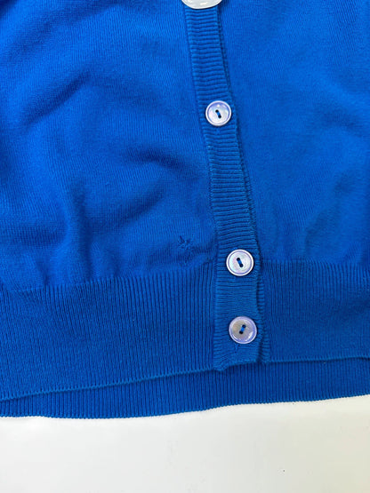 Maison Margiela electric blue cardigan with shoulder holes, minimalist design, soft knit material.