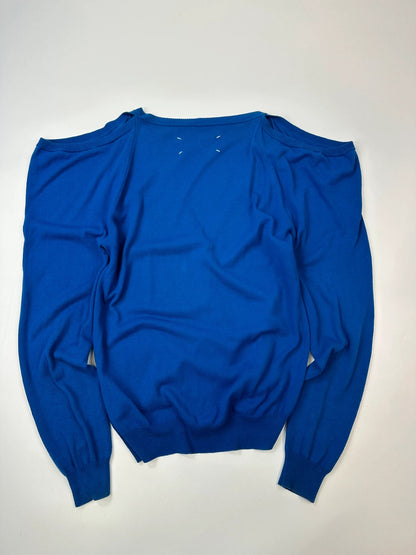 Maison Margiela electric blue cardigan with shoulder holes, minimalist design, soft knit material.
