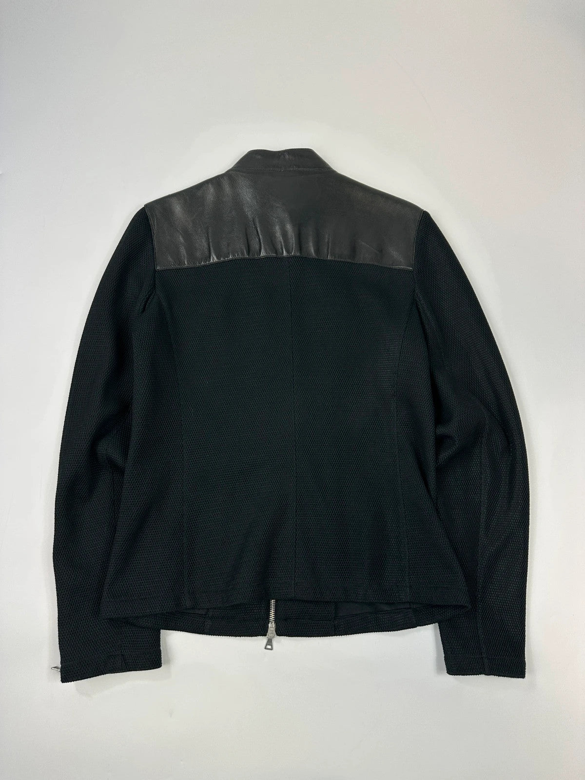 Prada black mesh and leather jacket with logo detailing and vintage design elements.