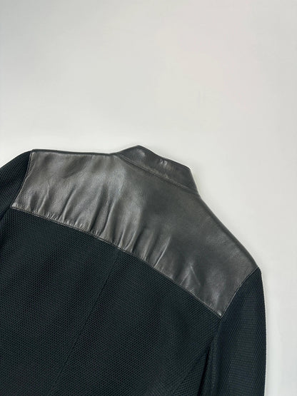 Prada black mesh and leather jacket with logo detailing and vintage design elements.