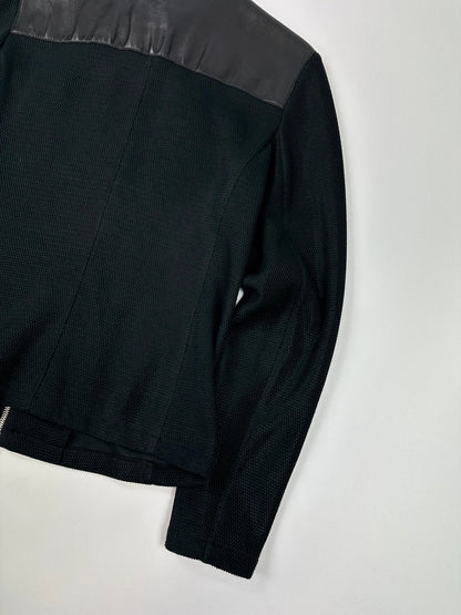 Prada black mesh and leather jacket with logo detailing and vintage design elements.