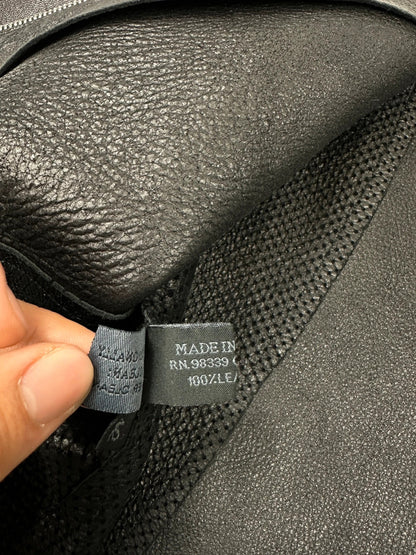 Prada black perforated leather jacket with subtle logo detailing and minimalist design.