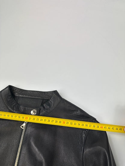 Prada black perforated leather jacket with subtle logo detailing and minimalist design.